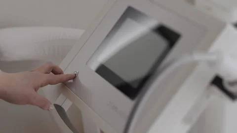 Womans hand pressing the power button. Stock Footage 313098572