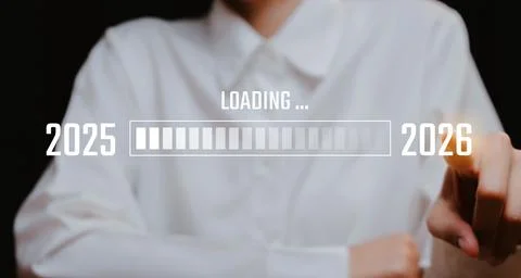 Woman's Hand on Progress Bar Transition from 2025 to 2026, Business concept. Stock Photos
