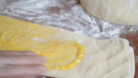 Woman's hand on puff pastry Stock Footage 95942806