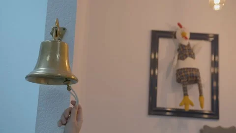 A woman's hand pulls the string of a bell for a meeting in the office against Video stock 172066021