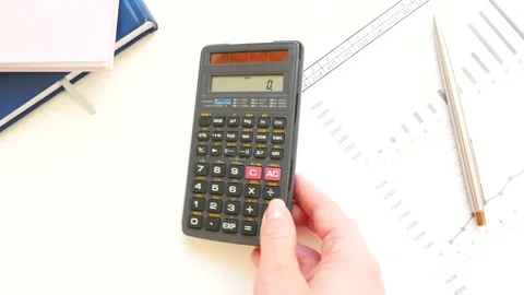 The womans hand put the calculator on the table. Stock Footage 152529893