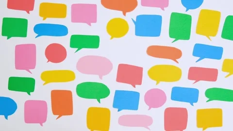 A woman's hand puts a pink speech bubble from a pattern Stock Footage 301864631
