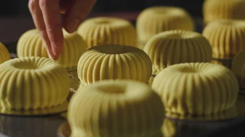 Woman's hand putting down fresh exquisite cake Stock Footage 240730934