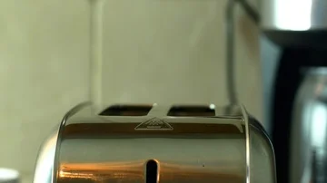 Woman's Hand Putting Two Slices Of Bread In The Toaster, Morning Ritual Stock Footage 85556696