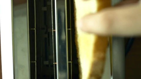 Woman's Hand Putting Two Slices Of Bread In The Toaster, Breakfast Stock Footage 85556920