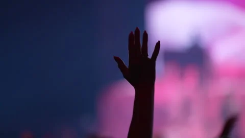 Woman's hand raised while worshiping in a large church. Stock Footage 196984680