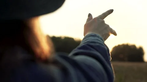 Woman's Hand Reaching for Sun in Field Stock Footage 346030274
