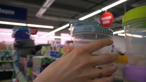 A woman's hand selects containers for storing food Stock Footage 269057282