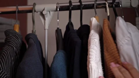 Woman's Hand Selects Things on a Hanger Close-up Stock Footage 255391921