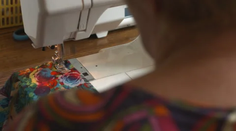 Woman's hand sewing on the sewing machine Stock Footage 68044919