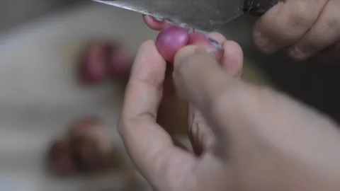A woman's hand skillfully peeling onions Stock Footage 287996630