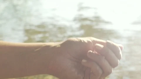 Woman's hand in slow motion with water on it Stock Footage 71326872