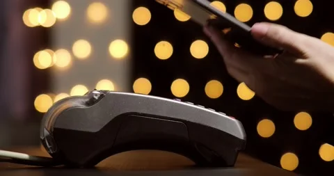 Woman's hand with smartphone using terminal for payment, non-cash transaction. Stock Footage 131065808