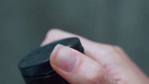 Woman's hand squeezing gel from a cosmetic tube Stock Footage 329103813