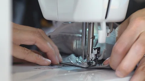 Woman's hand stitching fabric Stock Footage 94565730