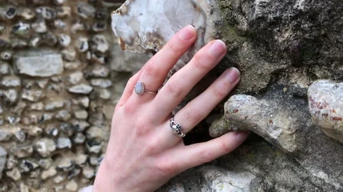 Woman’s hand on stone Stock Footage 150705190