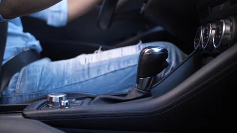 Woman's hand switching automatic transmission Stock Footage 112556996