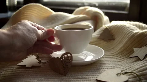 Womans hand takes mug of black coffee wrapped warm scarf Stock Footage 220347501