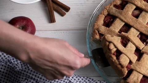 Woman's hand taking apple pie. Homemade apple pie with apples and cinnamon Stock Footage 231024479