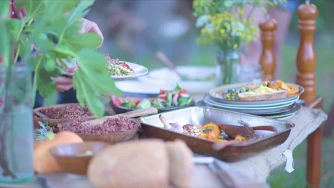 Woman's hand taking food from table Video stock 76136539