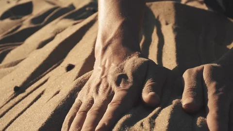 Woman's hand touching sand on beach Stock Footage 109543176