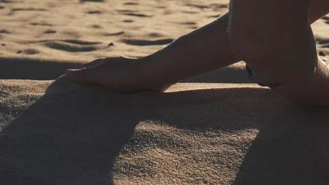 Woman's hand touching sand on beach Vídeo Stock 109608166