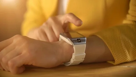 Woman's hand touching the screen of a smart watch Stock Footage 69968669