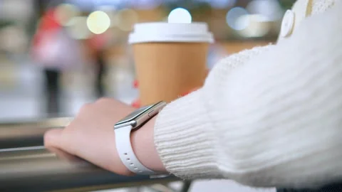Womans hand touching a smart watch. Smart watch on a womans hand indoor Stock Footage 232967220