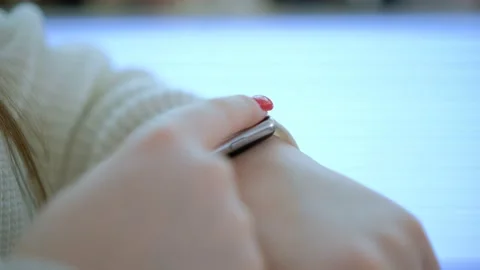 Womans hand touching a smart watch. Smart watch on a womans hand indoor Stock Footage 232989893