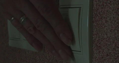 A woman's hand turns off the light. Stock Footage 309112194