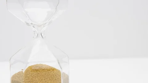 Womans hand turns a sand clock Stock Footage 116333532