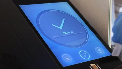 A woman's hand is typing a code on a computer control panel for a dna test Stock Footage 241226673