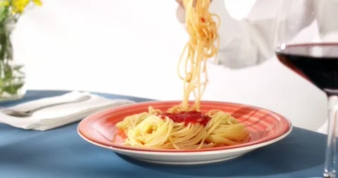 A woman's hand unsuccessfully tries to wind spaghetti on a fork. close-up. Stock Footage 245246796