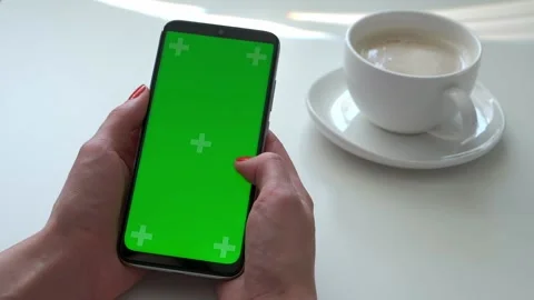 Woman's hand use green screen smartphone for online shopping at the cafe table Stock Footage 161306081