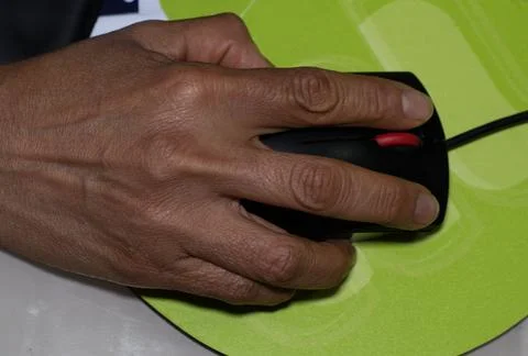A woman's hand using a computer mouse Foto stock