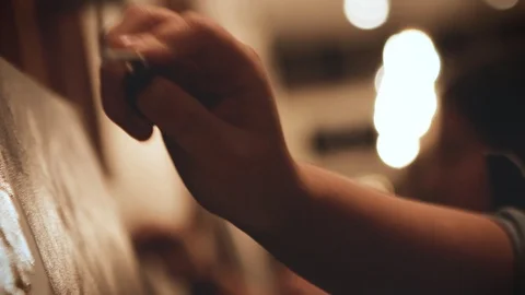 Woman's hand using palette knife in art class - slow motion close up shot Vídeo Stock 99998503