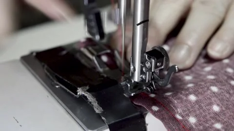 Woman's hand using a sewing machine, close-up view 스톡 동영상 146642784