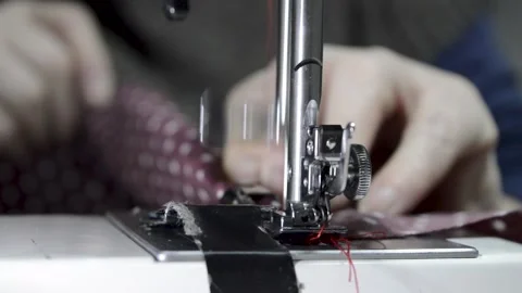Woman's hand using a sewing machine, close-up view 스톡 동영상 146642788
