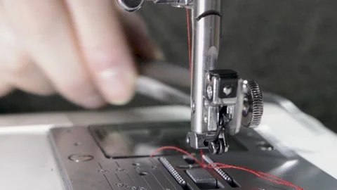Woman's hand using a sewing machine, close-up view 스톡 동영상 146642790