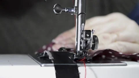 Woman's hand using a sewing machine, close-up view 스톡 동영상 146642791