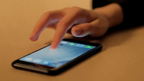 Woman's hand using a smartphone Stock Footage 104772596