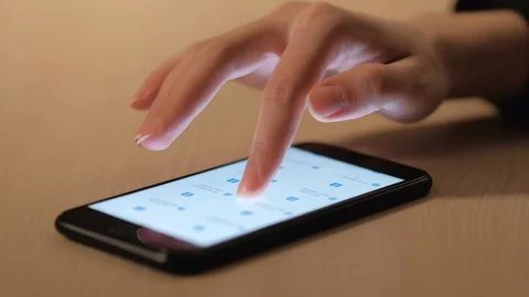 A woman’s hand using a smartphone Stock Footage 104772608