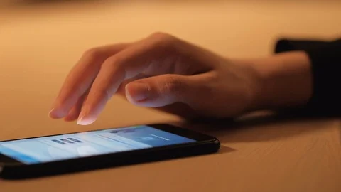 Woman's hand using a smartphone Stock Footage 104772612