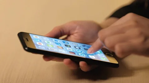 Woman's hand using a smartphone Stock Footage 104772613