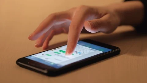 Woman's hand using a smartphone Stock Footage 104772624