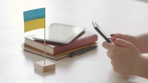Woman's hand using smartphone on wooden table, space for text or design. There Stock Footage 200451369