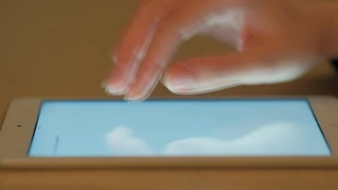 Woman's hand using a tablet Stock Footage 104772575