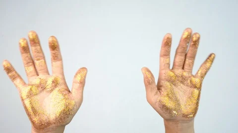 The woman's hand was smeared with glitter, waving back and forth, Stock Footage 119760057