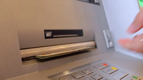 Woman's hand withdrawing us dollar bills from atm machine Stock-Footage 337644544