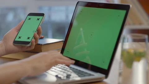 The woman's hand is working on the green screen computer. Stock Footage 148960825